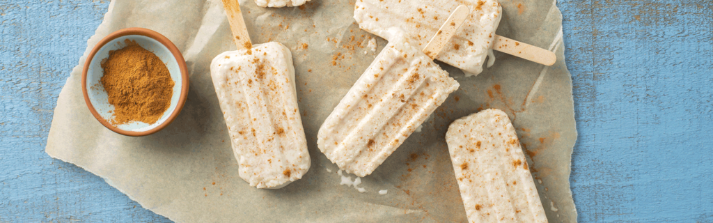 Four rice Mexican spiced paleta ice cream bars sprinkled with cinnamon