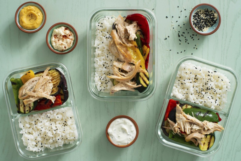 Chicken and rice meals with grilled vegetables