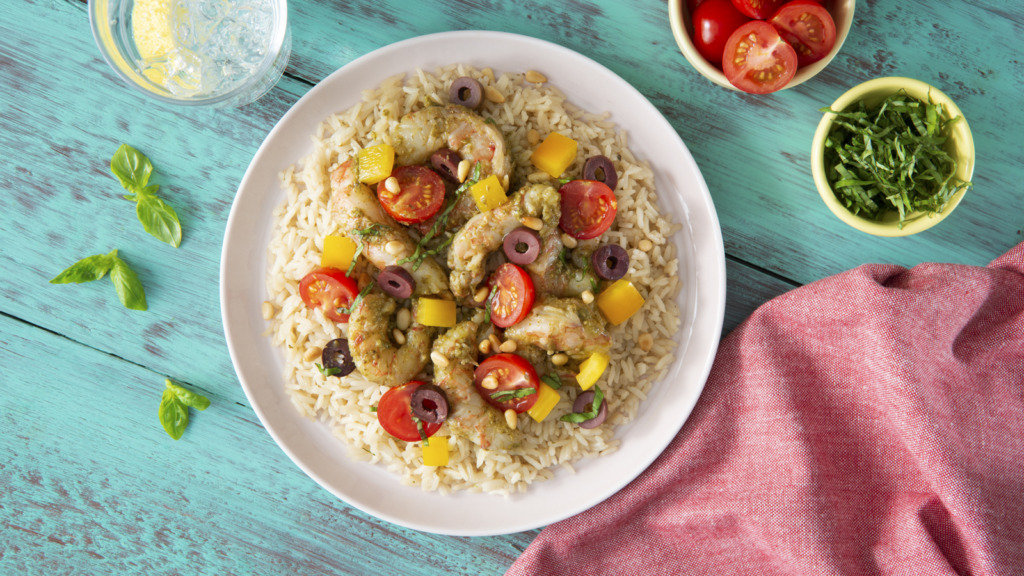 pesto shrimp over garlic and olive oil rice