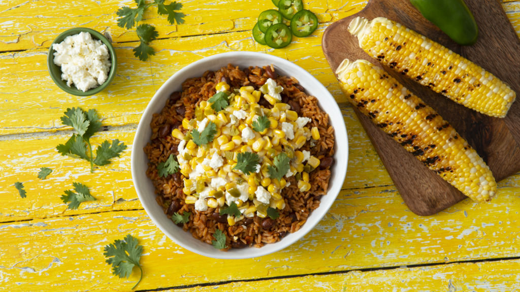 Mexican street corn rice bowl with beans and feta cheese