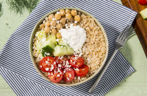 Greek-inspired rice bowl with chickpeas, brown rice, tomatoes and tzatziki sauce