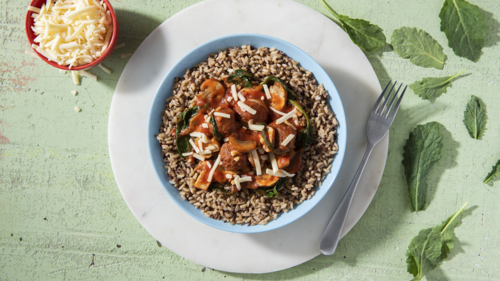 Multi-grain rice bowl with Italian meatballs, sauce and cheese