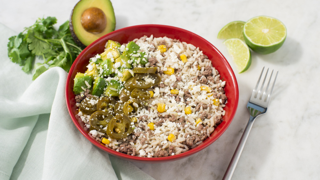 Rice-bowl-with-white-rice-mexican-style-corn-beef-and-crumbled-feta-cheese-and-avocado