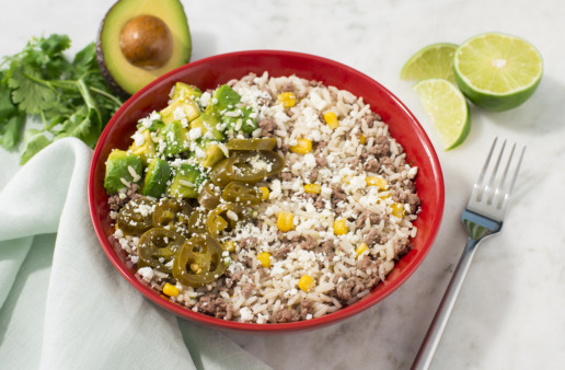Rice-bowl-with-white-rice-mexican-style-corn-beef-and-crumbled-feta-cheese-and-avocado