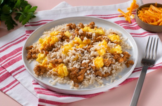 scrambled-eggs-with-cheese-and-sausage-served-over-white-rice