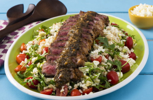 brown-rice-salad-with-arugula-avocado-and-cherry-tomatoes-topped-with-grilled-steak