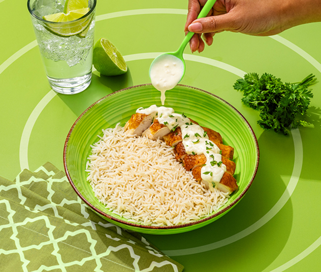 Chicken and rice meals with grilled vegetables